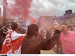 Britain braces for more riot mayhem: Masked protesters draped in England flags set off flares and attack cop cars in Sunderland, as police on horseback defend mosque from a large mob - amid fears of fresh far-right violence