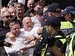 Britain's riot carnage deepens: Police hurt after bricks are hurled at cops, far-right thugs clash with Muslim groups as violence rages in Liverpool and Manchester, with yobs setting cars on fire in Hull