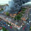 Crewe fire: Firefighters evacuate 250 homes and 150 houses are left without electricity after huge blaze at disused warehouse that spilt into neighbours' gardens as fire is STILL burning