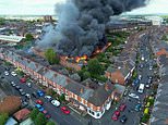 Crewe fire: Firefighters evacuate 250 homes and 150 houses are left without electricity after huge blaze at disused warehouse that spilt into neighbours' gardens as fire is STILL burning