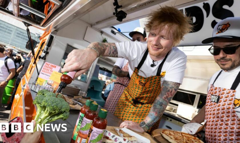 Ed Sheeran signs hot sauce autographs in car park