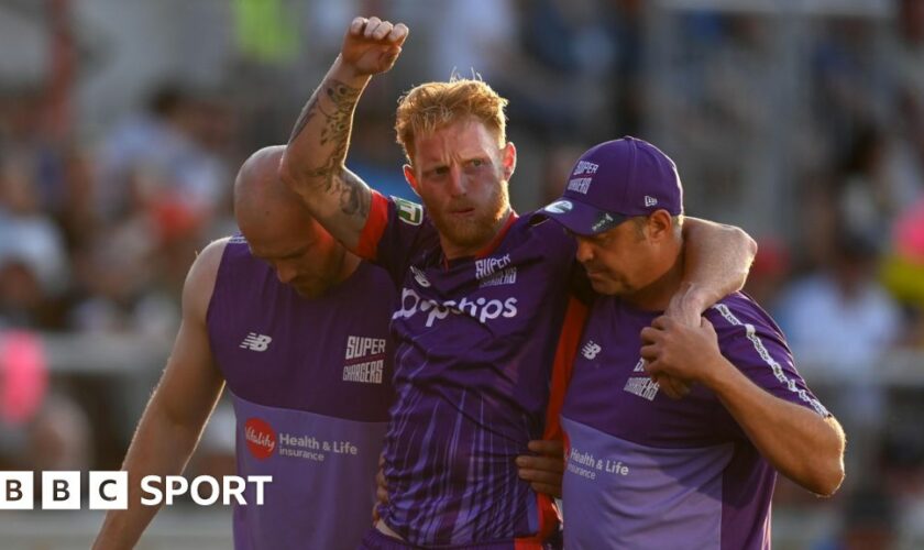 Ben Stokes being carried off the field by two members of Northern Superchargers' staff