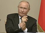 Feeling the pressure Vladimir? Putin shows his stress over Ukraine war by wringing his hands in meeting with shame-faced officials after Zelensky's troops invaded Russian soil