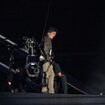 Hollywood legend Tom Cruise jumps from the ROOF the stadium in death-defying stunt during extravagant handover ceremony that transformed the Hollywood sign into Olympic rings before performances from Billie Eilish Red Hot Chili Peppers and Snoop Dogg