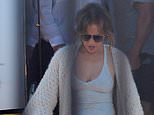 Jennifer Lopez jets back into Los Angeles after weeks in the Hamptons - as husband Ben Affleck unveils midlife crisis makeover amid looming divorce filing