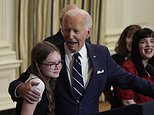 Joe Biden leaves daughter of freed hostage in tears as he awkwardly sings 'Happy Birthday' and hugs her while celebrating prisoner swap with Russia