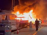 Millions of pounds goes up in smoke: Moment massive inferno destroys two luxury superyachts and a tourist boat at Greek port