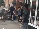 Moment 'gang of feral children' attack man, knocking him to the floor before stamping on his head in sickening assault outside of barber shop