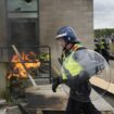 Moment masked man makes disturbing gesture to those inside Rotherham riot hotel