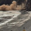 Moment thousands of rocks crash onto popular UK tourist spot just yards from beachgoers