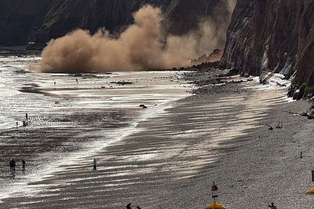 Moment thousands of rocks crash onto popular UK tourist spot just yards from beachgoers