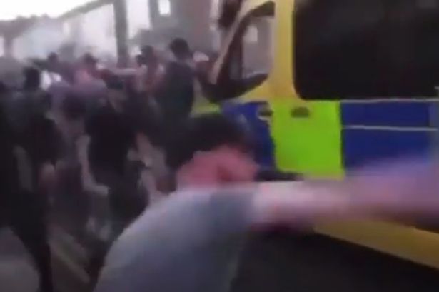 Moment thug hurls missile after 'laying flowers at Southport vigil for dance studio girls'