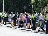 Mourners line the streets as horse-drawn carriage carries coffin of nine-year-old Alice da Silva Aguiar who was stabbed to death at Taylor Swift dance class in Southport