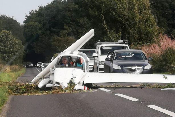 Pilot and passenger's miracle escape as aircraft crashes into road in Gloucestershire