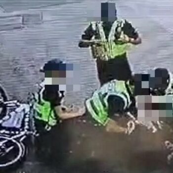 Police tackle teen off e-bike and 'kick and punch' him in 'brutal' arrest footage