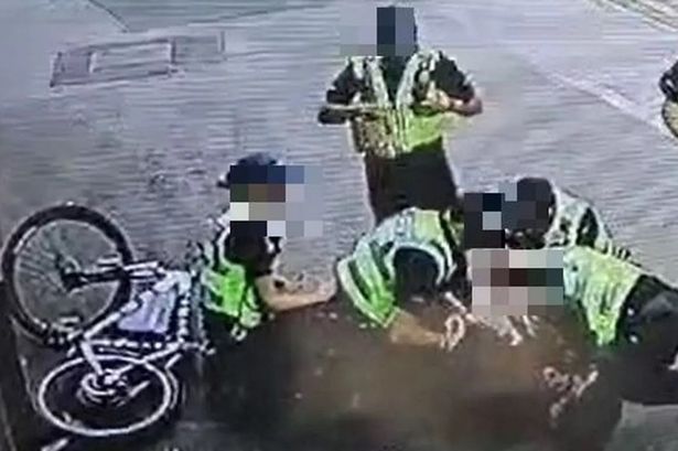 Police tackle teen off e-bike and 'kick and punch' him in 'brutal' arrest footage