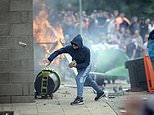 Rioters will face a 'reckoning' after far-right mobs set fire to hotels, attack police and bring chaos to Britain's streets as Home Secretary vows to go after those who 'whipped up' frenzy online as well after hundreds arrested