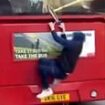 Shocking moment youth armed with a large knife clings to the back of a double-decker bus in Brighton as he hitches a ride around town