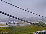 Terrifying videos show jets lurching around before aborting their landings with seconds to spare as deadly 157mph typhoon wreaks havoc in Japan