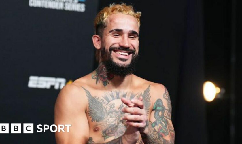 Ramon Taveras smiles backstage at a UFC event