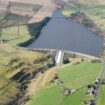 Underneath the reservoir that hides a secret village and is surrounded by woodland