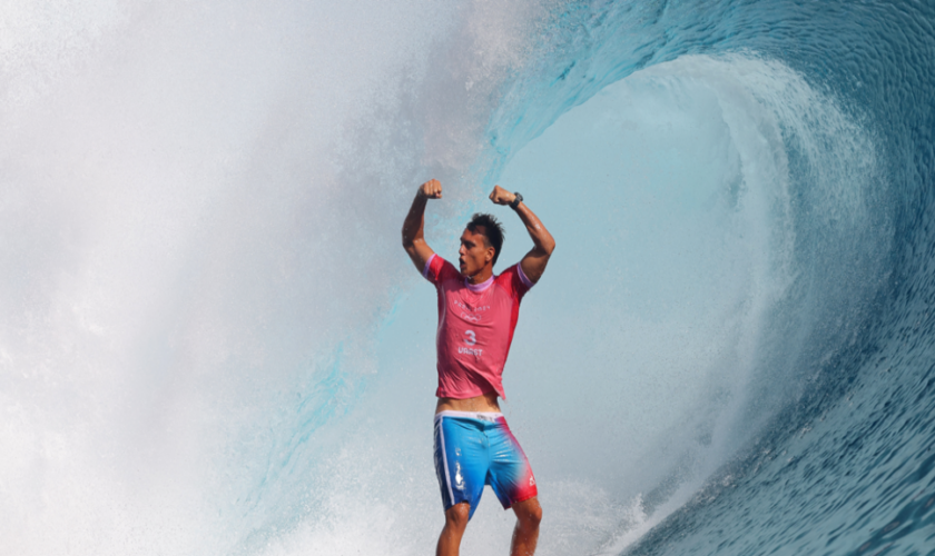 Kauli Vaast celebrates while surfing the Teahupo’o wave after becoming the 2024 Olympic champion