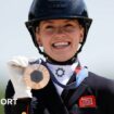 Charlotte Fry poses with her medal after winning the individual dressage bronze at the Paris 2024 Olympics