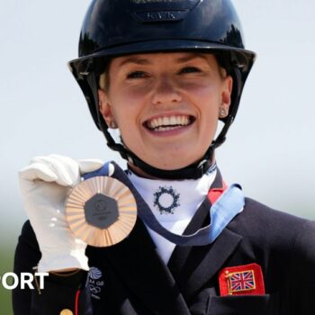 Charlotte Fry poses with her medal after winning the individual dressage bronze at the Paris 2024 Olympics