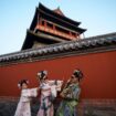 AP PHOTOS: Beijing's imperial palace bustles with throngs of visitors in Qing dynasty costumes