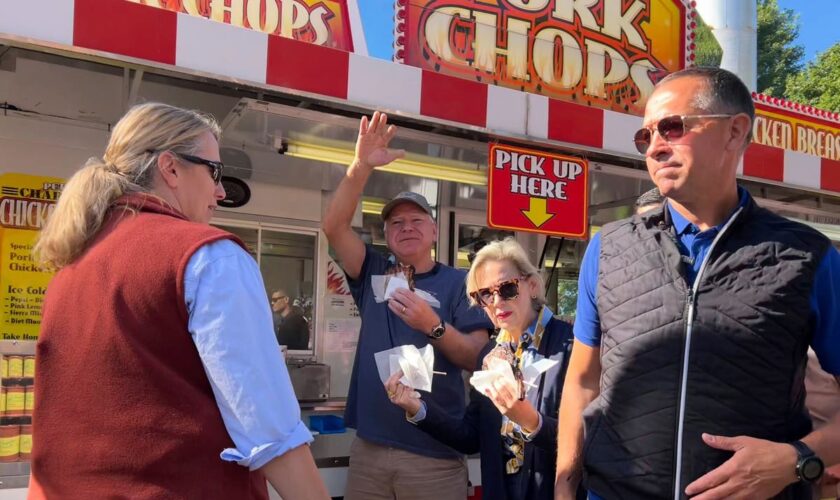 It's a pork chop on a stick and a vanilla shake for Tim Walz at the Minnesota State Fair