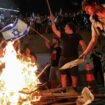 Demonstrators stand in front of a fire as protesters block a main road to show support for the hostages who were kidnapped during the deadly October 7 attack, amid the ongoing conflict in Gaza between Israel and Hamas, in Tel Aviv, Israel September 1, 2024. REUTERS/Florion Goga