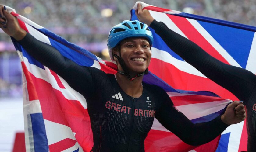 Kare Adenegan of Great Britain celebrates winning silver in Women's 100m - T34 Final. Pic: AP