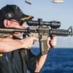 US Navy warship commander relieved of duty following image of him shooting rifle with scope mounted backward