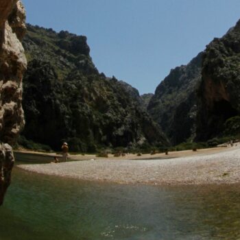 People sunbath at the "Torrent de Pareis" canyon, part of the cultural landscape of the Sierra de Tramuntana, on the northwestern coast of the Spanish Balearic island of Mallorca June 28, 2011. The cultural landscape of the Sierra de Tramuntana (Tramuntana mountain range) was inscribed on UNESCO's World Heritage List on Monday. REUTERS/ Enrique Calvo (SPAIN - Tags: ENVIRONMENT TRAVEL SOCIETY)