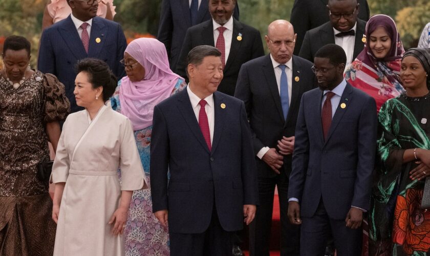 China's President Xi Jinping and his wife Peng Liyuan get ready to pose for a group photo together with leaders from African countries before a welcome dinner at the Forum on China-Africa Cooperation (FOCAC)