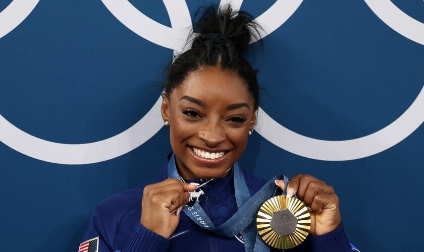 Simone Biles acknowledges diamond-studded GOAT necklace 'p---es people off'