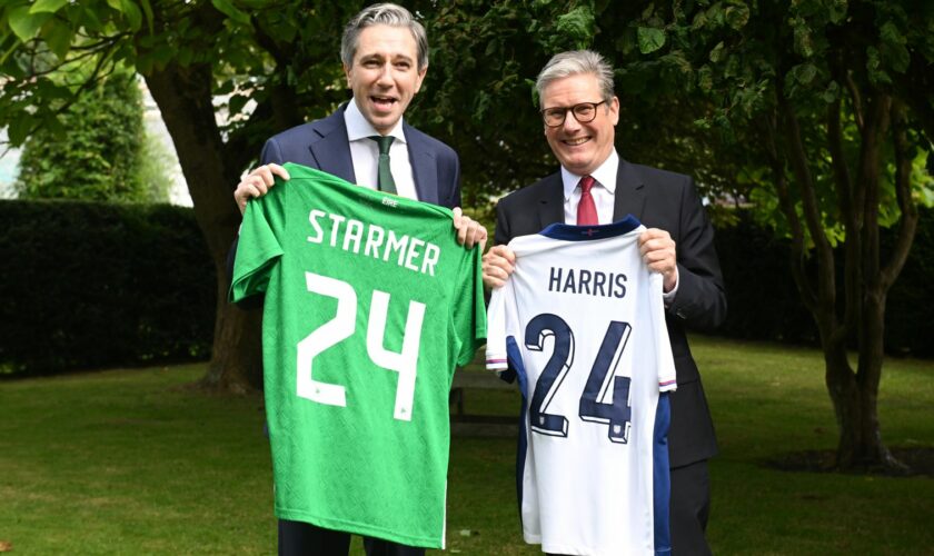 Sir Keir Starmer and Irish Taoiseach Simon Harris exchange football shirts in Dublin on Saturday. Pic: PA