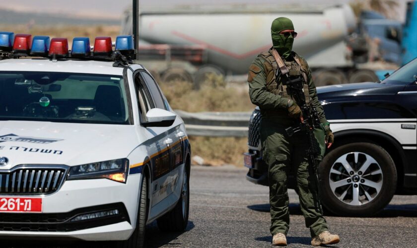 An Israeli soldier stands guard at the crossing after the shooting. Pic: Reuters