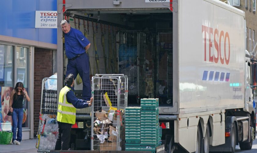 A delivery lorry outside a Tesco Express store in central London. Pressure is mounting on the Government to bring forward the date at which people who are double vaccinated against coronavirus can avoid self-isolation as emergency measures to protect food supplies were launched on Thursday. Picture date: Friday July 23, 2021.