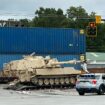 Train collides with military mobile artillery vehicle being hauled on a semi-truck