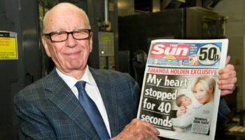 BROXBOURNE, UNITED KINGDOM - FEBRUARY 25:  (EDITORS NOTE: THIS IMAGE IS FREE FOR USE UNTIL MARCH 3 2012)  In this handout photograph provided by News International, Rupert Murdoch, Chairman and CEO of News Corporation, reviews the first edition of The Sun On Sunday as it comes off the presses on February 25, 2012 in Broxbourne, England. Around 3 million copies of 'The Sun On Sunday', the first ever Sunday edition of News International's daily tabloid newspaper 'The Sun', are due to go on sale on Sunday February 26, 2012.  (Picture Arthur Edwards/News International via Getty Images)