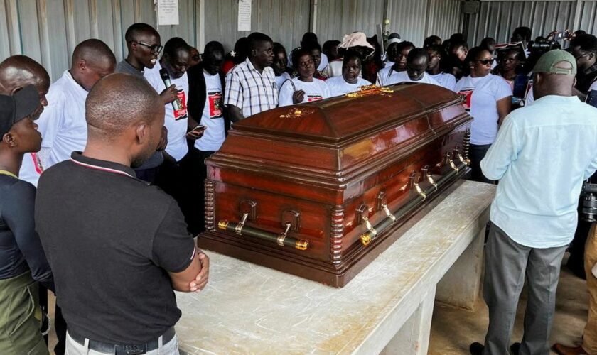 Family members mourn and react next to the coffin of the slain Olympian Rebecca Cheptegei, who died after her former boyfriend doused her in petrol and set her ablaze, at the Moi Teaching & Referral Hospital (MTRH) funeral home, in Eldoret, Kenya September 13, 2024. REUTERS/Edwin Waita