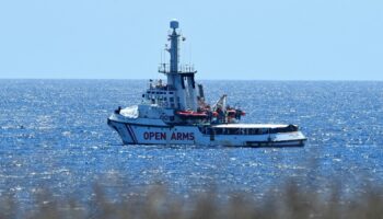 Spanish migrant rescue ship Open Arms is seen close to the Italian shore in Lampedusa, Italy, in August 2019. Pic: Reuters