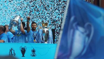 Soccer Football - Manchester City Victory Parade - Manchester, Britain - June 12, 2023 Manchester City's Ruben Dias celebrates with the Premier League trophy during the parade REUTERS/Carl Recine