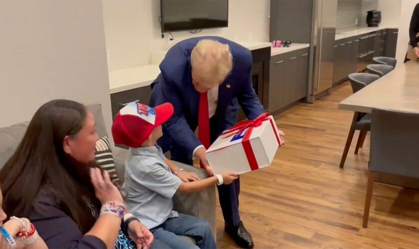 ‘Trump 2024!': Young supporter with rare brain disorder beams after surprise meeting with former president