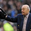 Mohamed al Fayed waves a Fulham scarf in front of supporters in 2012. Pic: Reuters