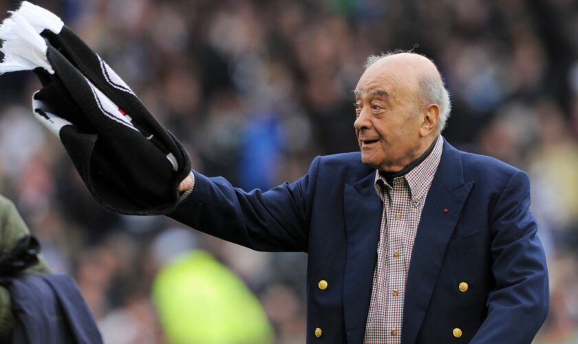 Mohamed al Fayed waves a Fulham scarf in front of supporters in 2012. Pic: Reuters