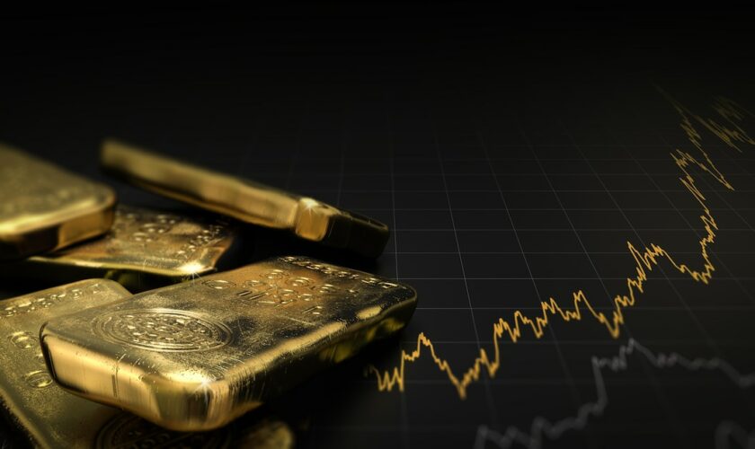 3D illustration of gold ingots over black background with a chart. Financial concept, horizontal image.