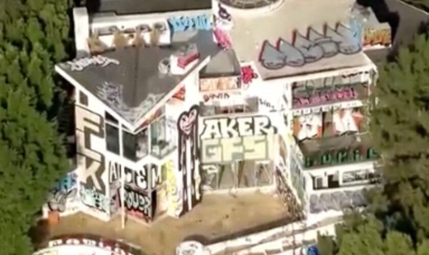 Squatters target multi-million dollar mansion in LA creating an eyesore for wealthy neighbors