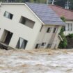 A house leans as a swollen river undermines the ground in Suzu, Japan, Sunday, Sept. 22, 2024, following heavy rain in central Japan's Noto peninsula area, where a devastating earthquake took place on Jan. 1. (Kasumi Fukudome/Kyodo News via AP)